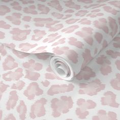 a pink and white wallpaper with an animal print pattern on the back of it