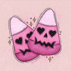 two pink slippers with hearts and faces drawn on the bottom one has black eyes