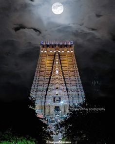 the top of a tall building under a full moon