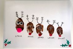 handprinted reindeer faces and antlers on a white board