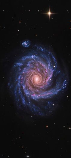 a spiral galaxy with stars in the background