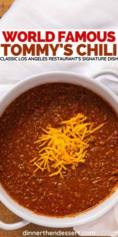 a bowl of chili with cheese on top and the words world famous tommy's chili