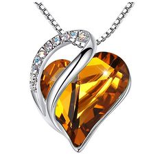 Made with finest authentic Swarovski Crystal; Ultra durable with a thick layer of white gold silver plating. SPECIFICATIONS : Pendant Size: 0.5" x 0.9" Chain Length: 18"+ 2" Plating: White Gold Plated Silver-tone Clasp: Lobster Claw Stone: Swarovski Crystal Wild Heart Shaped Stone, Amber Brown November Birthstone; Swarovski Flatback Zirconia Rhinestones, Crystal AB Color. Heart Gem, Embossed Jewelry, Amber Heart, Infinity Love, Pretty Necklaces, Crystal Necklace Pendant, Love Necklace, Fashion Mode, Heart Pendant Necklace