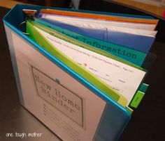 a file folder filled with files sitting on top of a table