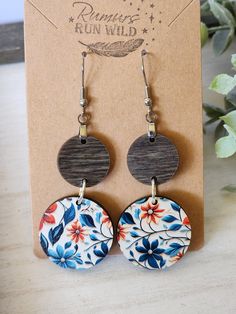 Handmade Wood Dangle Earrings! Gift your best friend these colorful wood boho dangle earrings and make her day. These circle earrings are created with natural wood in a denim stain on top and a colorful flower patterned wood circle for the bottom. The bottom is a pattern of florals. These are a perfect gift for any earring lover you know.  These lightweight, front facing earrings are created with Nickel free, hypoallergenic, stainless steel hooks that are great for sensitive ears. While the colo Bohemian Multicolor Wooden Bead Earrings, Blue Bohemian Earrings With Wooden Beads, Bohemian Blue Earrings With Wooden Beads, Wood Dangle Earrings, Boho Earring, Flower Dangle Earrings, Spring Earrings, Gift For Friend, Floral Earrings