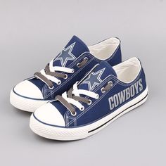 a pair of blue sneakers with the word cowboys on them