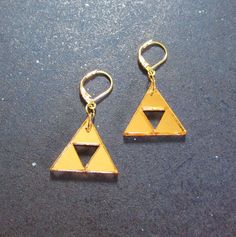 the legend of zelda earrings are yellow and have two triangles on each earring