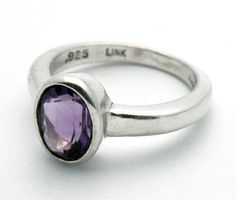 Amethyst Ring Modern Oval Birthstone Ring With Gemstone, Modern Amethyst Ring With Bezel Setting, Modern Oval Stackable Rings With Polished Finish, Elegant Amethyst Bezel Set Oval Cabochon Ring, Modern Sterling Silver Amethyst Ring, Elegant Amethyst Oval Cabochon Ring With Bezel Setting, Modern Oval Sterling Silver Birthstone Ring, Modern Oval Birthstone Ring In Sterling Silver, Oval Gemstone Stackable Rings For Formal Occasions