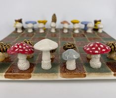 a chess board with several small mushrooms on it