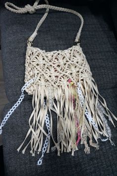 Charming and free-spirited crochet fringe crossbody bag. Perfect for festivals! Smaller style features a flap closure design. Inside has one small pocket.  This item has been altered from it's original design. Good used condition; may have some flaws due to use.  Color is Ivory. Simple design. Product Material: Cotton/poly/acrylic Depth: 7.5" Width: is 9" Strap Drop: 27"  Additional Info: SMOKE FREE HOME    Shipping We ship our items out within 2 business days; unless there is a personal situation and therefore you will be notified.  Method of shipment is United States Postal Service. During peak times, mail may be delayed due to demand. International shipment will go Priority Mail International/Small Flat Rate Box Please be sure your mailing address is accurate as I cannot be responsible Cream Bohemian Hobo Bag For Summer, Summer Bohemian Cream Hobo Bag, Spring Bohemian Woven Hobo Bag, Spring Bohemian Beige Crochet Bag, Bohemian Cream Hobo Bag For The Beach, Bohemian Cream Hobo Bag For Beach, Beige Bohemian Hobo Bag For Spring, Spring Bohemian Beige Hobo Bag, Spring Beige Bohemian Hobo Bag