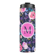 a black and pink floral can cooler with the letter m on it