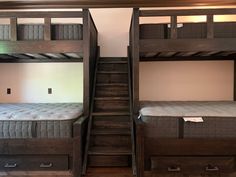 two bunk beds sitting next to each other in a room