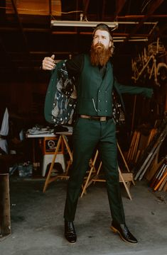 Raise an axe to this viking wedding • Offbeat Wed (was Offbeat Bride) Forest Green Suits For Men, Forest Wedding Mens Attire, Mens Fantasy Suit, Celestial Wedding Suit, Forest Green Tuxedo Wedding, Viking Groom Attire, Forest Green Wedding Suit, Moody Celestial