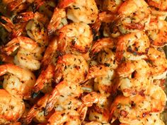 shrimp skewers are piled on top of each other