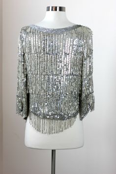 "Gatsby style Sparkly vintage all beaded top...watch yourself whirl and twirl with all the beads...this one is awesome!! And in Very good condition!! Silk with heavy long beading and sequins...made to wear loose..great for a size Xs or small Measuring: 22\" long at longest point 36\" wide Pet Free/smoke free Enjoy!" Glamorous Hand Embellished Tops For Party, Glamorous Hand Embellished Party Tops, Glamorous Beaded Tops For Wedding, Elegant Evening Tops With Beaded Fringe, Elegant Silver Beaded Tops, Vintage Beaded Tops For Party, Silver Beaded Party Tops, Halter Wedding, Gatsby Style