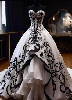 a white and black wedding dress on display