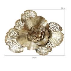 an image of a flower made out of gold foil on a white background with measurements