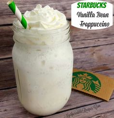 starbucks vanilla bean frappeccino in a mason jar with a green and white straw