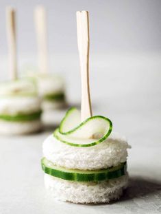 cucumber and cheese appetizers with toothpicks on them