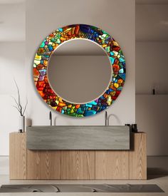 a bathroom with a round mirror on the wall