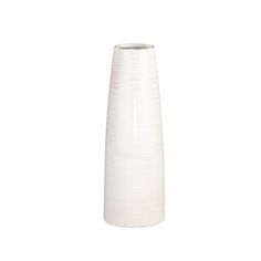 a tall white vase sitting on top of a table