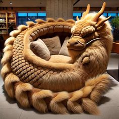 a large stuffed dragon sitting on top of a table