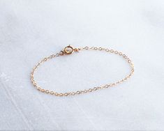 Simple Chain Bracelet in silver, rose or gold chain option. A sparkling chain for a minimal and chic touch for everyday. Makes the perfect gift too! D E T A I L S -Dainty link chain -High quality 14kt gold filled, rose filled or sterling silver - not plated. -Spring Ring closure LENGTH - Please select from the drop down selection. - Fits most sizing: 6.0 inches extra small 6.5 inches small 7.0 inches medium 7.5 inches large. ∙ EXTRA LOVE ∙ Crafted and curated just for you in the desert of our Ar Simple Gold Chain, Gold Chain Bracelet, Simple Chain, Bracelet In Silver, Bracelet Dainty, Dainty Bracelet, Simple Bracelets, Double Chain, Dainty Bracelets