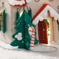 a christmas scene with a gingerbread house and candy canes