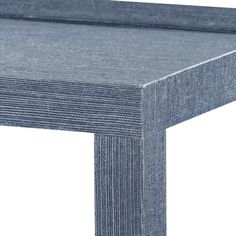 a close up view of the top of a table with blue wood grained finish