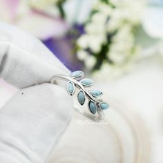 "This is a solid 925 sterling silver leaf branch ring inlaid with real, genuine larimar gem stones. This delicate, dainty looking ring is great for girls & women. It can be used on any fingers like pinky, midi, middle, index, thumb or ring fingers. Materials: Solid 0.925 sterling siler. Tarnish free. Face Width: 8mm or about 1/3\" and about 12mm or 0.65\" long. This ring is about medium in size. Not big and not small. Each leaf is set with a small larimar. You can wear this ring everyday and it' Turquoise Larimar Ring In Silver, Silver Turquoise Larimar Ring For Anniversary, Silver Larimar Turquoise Ring For Anniversary, Anniversary Turquoise Larimar Ring In Silver, Anniversary Silver Turquoise Larimar Ring, Index Ring, Silver Leaf Ring, Olive Leaves, Ring Everyday