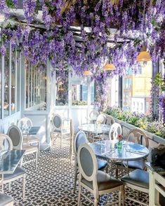 an outdoor dining area with wister hanging from the ceiling