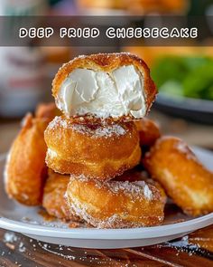 a pile of doughnuts sitting on top of a plate covered in cream cheese