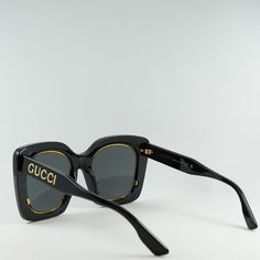 Indulge in the luxury and sophistication of Gucci with the stunning GG1151S 001 Black/Grey sunglasses. These iconic butterfly-shaped frames exude elegance and style, perfect for the fashion-forward woman who wants to make a statement. Crafted from high-quality acetate, the black frame is sleek and modern, while the grey lenses add a touch of mystery and allure. The classic color combination of black and grey never goes out of style, making these sunglasses a timeless addition to your accessory collection. With a lens socket width of 51mm and a bridge size of 23mm, these sunglasses are designed to fit comfortably and securely on your face. The temple length of 145mm ensures a perfect fit for all-day wear, whether you're running errands or lounging by the pool. The Gucci GG1151S 001 Black/Gr Classic Party Sunglasses With Tinted Lenses, Classic Tinted Sunglasses For Party, Classic Tinted Sunglasses For Parties, Gucci Classic Cat Eye Sunglasses With Uv Protection, Classic Gucci Cat Eye Sunglasses With Uv Protection, Gucci Cat Eye Sunglasses With Uv Protection, Trendy Gucci Cat Eye Sunglasses With Tinted Lenses, Trendy Gucci Cat Eye Sunglasses With Gradient Lenses, Trendy Gucci Cat Eye Tinted Sunglasses