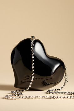 SIMONMILLER's Molded Heart Bag showcases an abstract heart shape with interchangeable straps that let you switch up the look. | Molded Heart Bag by SIMONMILLER in Black, Women's, Resin at Anthropologie Chic Everyday Heart-shaped Shoulder Bag, Chic Heart-shaped Shoulder Bag For Everyday, Elegant Heart-shaped Bag For Everyday Use, Luxury Heart-shaped Shoulder Bag As Gift, Luxury Heart-shaped Shoulder Bag For Gift, Elegant Heart-shaped Bags, Luxury Heart-shaped Party Shoulder Bag, Chic Heart-shaped Bag With Detachable Strap, Heart-shaped Shoulder Bag With Removable Pouch As Gift