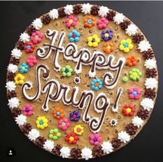 a cake with the words happy spring written on it