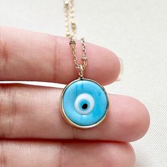 DETAILS: Handmade necklace 18k Gold Filled Necklace with Gold Filled Charm 🧿 Chain size 14" + 2 inchs chain. CARE: Try to avoid your jewelry coming into contact with perfumes, skin and hairs products Store your jewelry in a dry, airtight place. Made with Love 💙 Evil Eye Round Pendant Necklace Gift, Amulet Eye Necklace Gift, Eye-shaped Amulet Necklace As Gift, Gold Plated Evil Eye Round Necklaces, Gold Plated Evil Eye Round Necklace, Gold Plated Round Evil Eye Necklace, Evil Eye Charm Necklace With Round Pendant For Gifts, Evil Eye Charm Necklace With Round Pendant As Gift, Blue Charm Necklace Gift - Tarnish Resistant