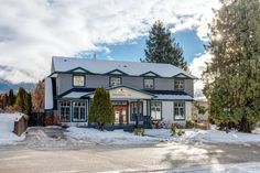 a large house with snow on the ground