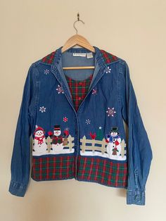 Vintage Christmas "Canadian Tuxedo" Just Kidding. This is a button up denim shirt with Embroidered Snowmen Scene. There is a faux vest in a Christmas tartan print attached to shirt on the inside. Either leave unbuttoned to show vest, or button shirt to not show vest. Little green tree plastic buttons on sleeves and along front. Brand: Dress Barn Material: 100% Cotton Size on Tag: Small (Please see Measurements below and leave room for comfort and ease). ✂ - - - - - M E A S U R E M E N T S:  take Winter Embroidered Button-up Tops, Embroidered Collared Winter Tops, Denim Button-up Top For Winter, Holiday Festive Long Sleeve Shirt, Faux Vest, Christmas Tartan, Shirt With Collar, Canadian Tuxedo, Brand Dress