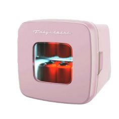 a pink toaster with an image of two red candles in the oven on it