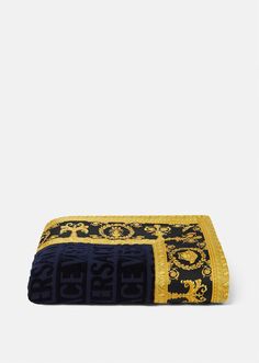 a black and yellow towel with gold trim