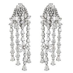 These impressive 18kt white gold chandelier earrings showcase 20.32cts of dazzling marquise, pear, and round shaped diamonds in a sure to stand out flowing design. Handcrafted in Italy by ZYDO Italian Jewelry.Diamond Quality: Color F, Clarity VSDiamond Carat Weight: 20.32Dimension: 2 7/8 in. x 1 in. Refinery 29, Gold Chandelier Earrings, Bridal Bangles, Italian Jewelry, Precious Jewels, Gold Chandelier, Jewelry Diamond, High Jewelry, Half Up