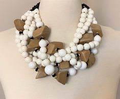 "I designed This necklace inspired by Angela Caputi White & Beige Beads With Rhinestone Rondelles Multi Strand Statement Necklace One of A Kind! Just stunning, very good condition, Four strand, hook clasp, It measure 21\" long plus 3\" chain, The pictures are part of the description so please look at all the pictures and if you have any question please feel to ask before bidding! Make sure you check out my other vintage items!" Elegant White Jewelry With Wooden Beads, White Multi-strand Necklace With Wooden Beads, Elegant White Beaded Necklaces With Wooden Beads, Elegant White Beaded Necklace With Wooden Beads, Elegant White Necklaces With Wooden Beads, Elegant White Wooden Beaded Necklaces, White Multi-strand Beaded Necklace With Wooden Beads, White Multi-strand Wooden Beaded Necklaces, Big Necklace