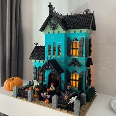 a lego house with halloween decorations on the outside