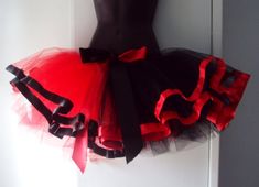 a red and black tutu skirt on a mannequin