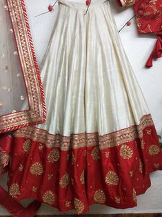 Red and White Minimalist Silk Lehenga for Modern Brides Product Specification Color: White and red (colors can be adjusted upon request) Fabric: Silk Occasion: Bridal, Engagement, Formal Event, Reception, Wedding Style: Lehenga Choli w/Dupatta Work: Gold Zardozi work Mix your glamour with the conventional bridal red on your D-day in this minimalist and elegant red and white bridal lengha which is intricately hand-embroidered in minimal zardozi goldwork. Minimal Bridal Look Features: Bicolor - mo Red And Gold Lehenga Simple, White And Red Lehenga Brides, Cream And Red Lehenga, Simple Bride Lehenga, Red And White Indian Outfit, Red White Lehenga Choli, White Bridal Lehenga With Red Dupatta, Red And White Lehenga Bridal, Lengha Design For Wedding