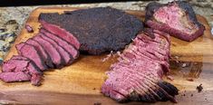 some meat is sitting on a cutting board