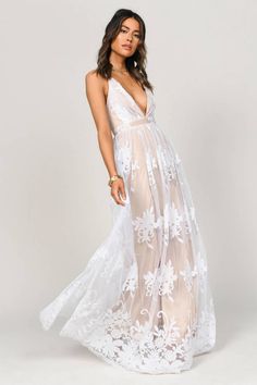 Introducing an elegant gown that will leave 'em speechless. The Analise Plunging Floral White Maxi Dress is a captivating long formal lace dress that  - Fast & Free Shipping For Orders over $50 - Free Returns within 10 days! Elegant White Maxi Dress With Delicate Lace, White Delicate Lace Maxi Dress, White Sleeveless Maxi Dress With Delicate Lace, Whimsical White Floral Print Dress, Savannah Elopement, Sunset Soiree, White Lace Maternity Maxi Dress, Formal Lace Dress, Plunging Dress