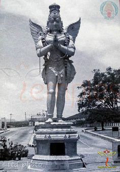 an old black and white photo of a statue