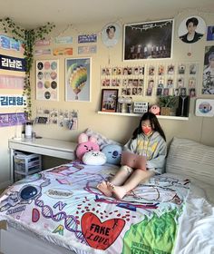 a woman sitting on top of a bed in a bedroom