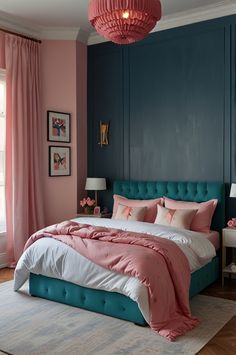 a bed with pink and blue sheets in a bedroom